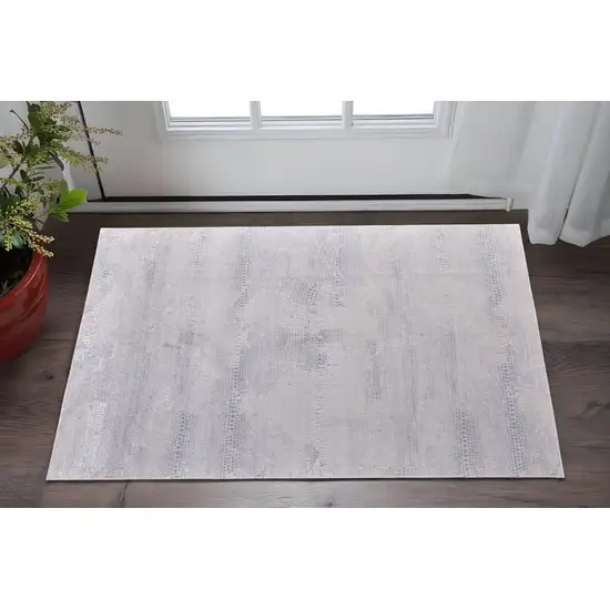 Ivory and Silver Abstract Power Loom Worn Faded Area Rug Photo 1