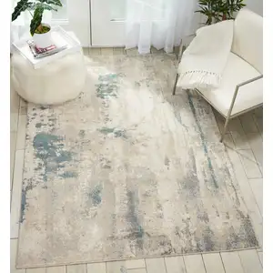 Photo of Ivory and Teal Blue Abstract Non Skid Area Rug