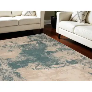 Photo of Ivory and Teal Blue Abstract Non Skid Area Rug