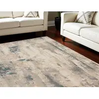 Photo of Ivory and Teal Blue Abstract Non Skid Area Rug