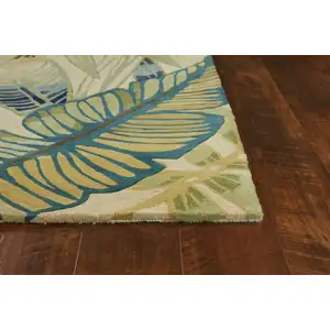 Photo of Ivory or Teal Tropical Leaves Wool Indoor Area Rug