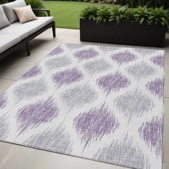 Lavender Purple And Ivory Ikat Washable Indoor Outdoor Area Rug Photo 1