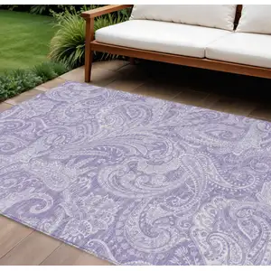 Photo of Lavender Purple And Ivory Paisley Washable Indoor Outdoor Area Rug