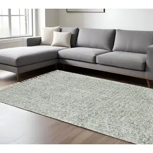 Photo of Light Blue And Ivory Abstract Shag Area Rug With Fringe