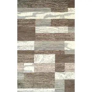 Photo of Light Blue And Ivory Patchwork Power Loom Stain Resistant Area Rug