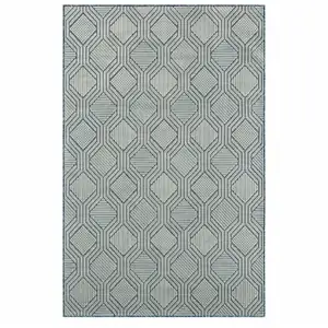 Photo of Light Blue And Navy Geometric Stain Resistant Area Rug