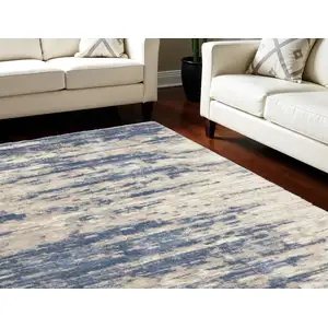 Photo of Light Blue Gray and Beige Abstract Shag Area Rug