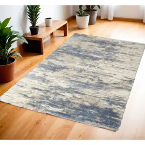 Photo of Light Blue Gray and Beige Abstract Shag Area Rug