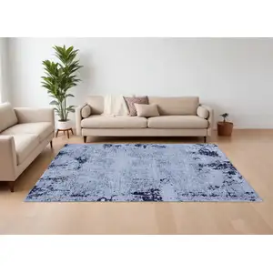 Photo of Light Blue and Black Abstract Power Loom Area Rug