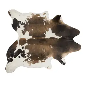 Photo of Light Brown and White Cowhide Hand Knotted Area Rug