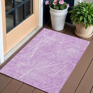 Photo of Lilac And Ivory Abstract Washable Indoor Outdoor Area Rug