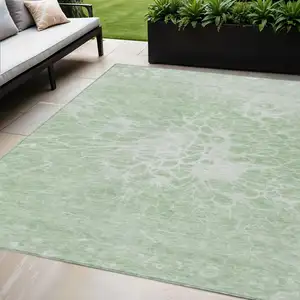 Photo of Mint Green And Ivory Abstract Washable Indoor Outdoor Area Rug