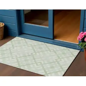 Photo of Mint Green And Ivory Geometric Washable Indoor Outdoor Area Rug