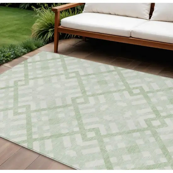 Mint Green And Ivory Geometric Washable Indoor Outdoor Area Rug Photo 1