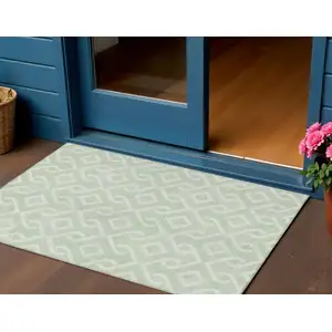 Photo of Mint Green And Ivory Geometric Washable Indoor Outdoor Area Rug