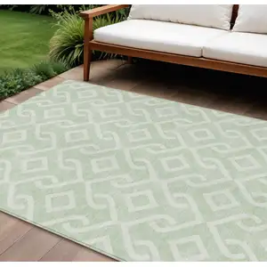 Photo of Mint Green And Ivory Geometric Washable Indoor Outdoor Area Rug