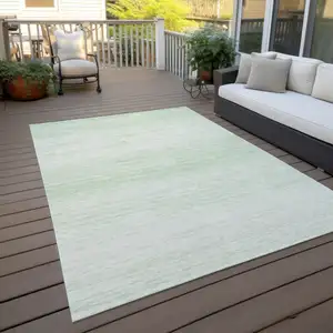 Photo of Mint Green And Ivory Striped Washable Indoor Outdoor Area Rug