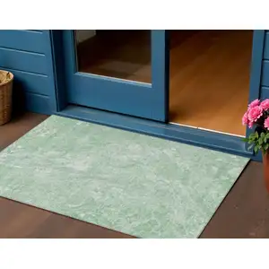 Photo of Mint Green Sage And Ivory Abstract Washable Indoor Outdoor Area Rug