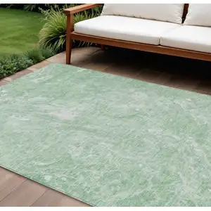 Photo of Mint Green Sage And Ivory Abstract Washable Indoor Outdoor Area Rug