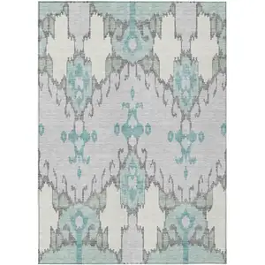 Photo of Mint Green Teal Blue And Ivory Ikat Washable Indoor Outdoor Area Rug