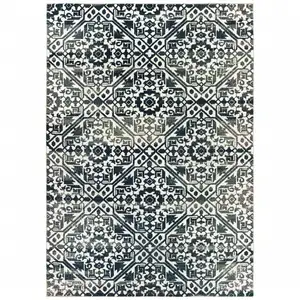 Photo of Navy And Ivory Geometric Power Loom Stain Resistant Area Rug