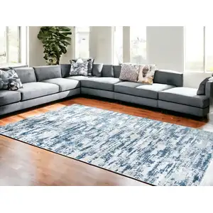 Photo of Navy Blue Abstract Washable Non Skid Area Rug With Fringe