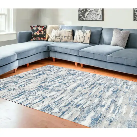 10' Blue and Off White Abstract Washable Non Skid Runner Area Rug Photo 1