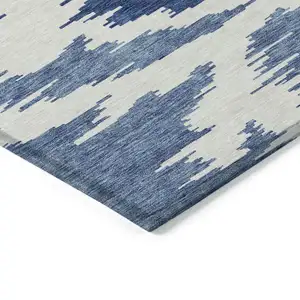 Photo of Navy Blue And Denim Blue Abstract Washable Indoor Outdoor Area Rug