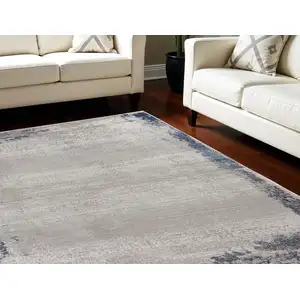 Photo of Navy Blue And Gray Abstract Distressed Area Rug