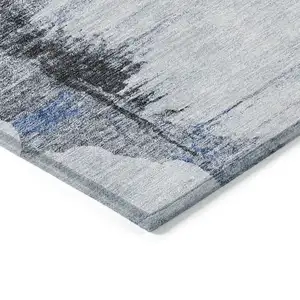 Photo of Navy Blue And Ivory Abstract Washable Indoor Outdoor Area Rug