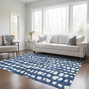 Photo of Navy Blue And Ivory Abstract Washable Indoor Outdoor Area Rug