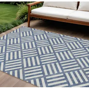 Photo of Navy Blue And Ivory Geometric Washable Indoor Outdoor Area Rug