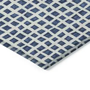 Photo of Navy Blue And Ivory Geometric Washable Indoor Outdoor Area Rug