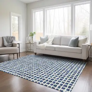 Photo of Navy Blue And Ivory Geometric Washable Indoor Outdoor Area Rug