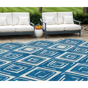 Photo of Navy Blue And Ivory Geometric Washable Indoor Outdoor Area Rug