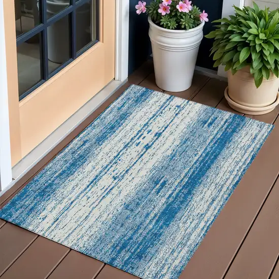 Navy Blue And Ivory Striped Washable Indoor Outdoor Area Rug Photo 1