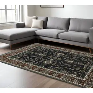 Photo of Navy Blue And Rust Oriental Area Rug With Fringe