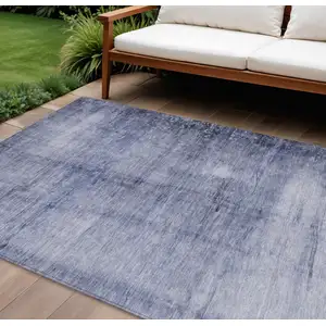 Photo of Navy Blue And Sky Blue Abstract Washable Indoor Outdoor Area Rug