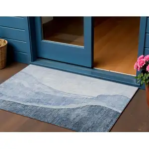 Photo of Navy Blue And Sky Blue Abstract Washable Indoor Outdoor Area Rug