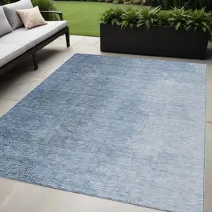 Photo of Navy Blue And Sky Blue Abstract Washable Indoor Outdoor Area Rug