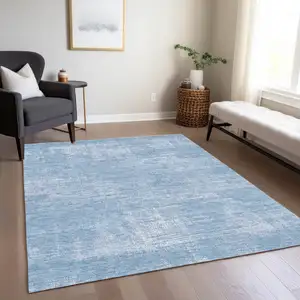 Photo of Navy Blue And Sky Blue Abstract Washable Indoor Outdoor Area Rug