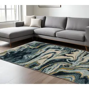 Photo of Navy Blue And Teal Abstract Area Rug With Fringe