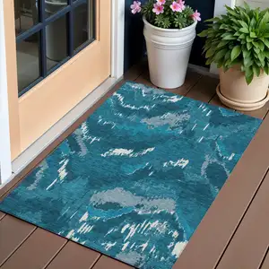 Photo of Navy Blue And Teal Blue Abstract Washable Indoor Outdoor Area Rug