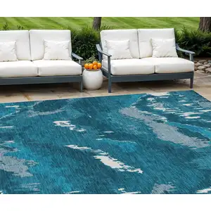 Photo of Navy Blue And Teal Blue Abstract Washable Indoor Outdoor Area Rug