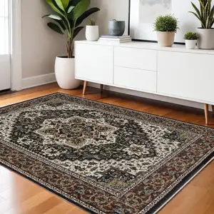 Photo of Navy Blue Ivory And Black Medallion Area Rug With Fringe