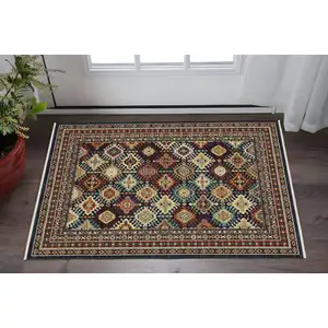 Photo of Navy Blue Ivory And Brown Oriental Area Rug With Fringe