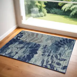 Photo of Navy Blue Light Blue and Gray Botanical Leaves Area Rug