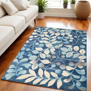 Photo of Navy Blue and Beige Botanical Leaves Area Rug