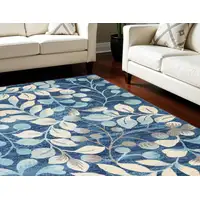 Photo of Navy Blue and Beige Botanical Leaves Area Rug