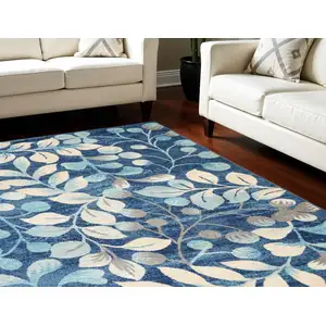 Photo of Navy Blue and Beige Botanical Leaves Area Rug